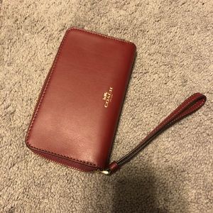 Coach maroon wristlet with C detailing